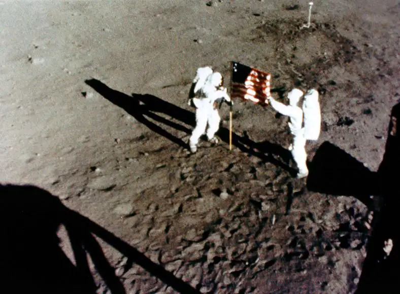 Astronauts Neil Armstrong and Buzz Aldrin on the surface of the Moon during the Apollo 11 mission
